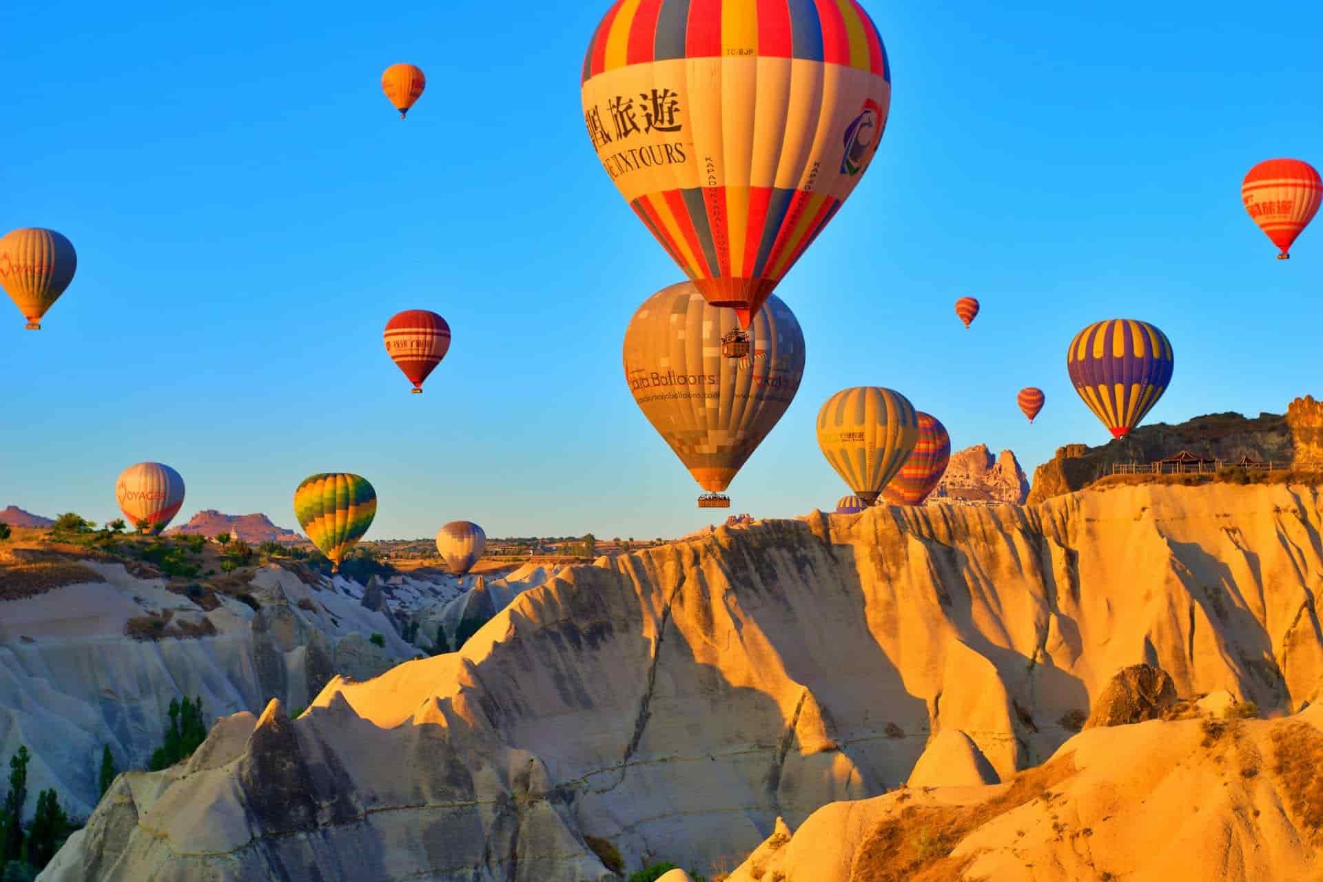 Cappadocia airport transfer — hot air balloons over Göreme at sunrise